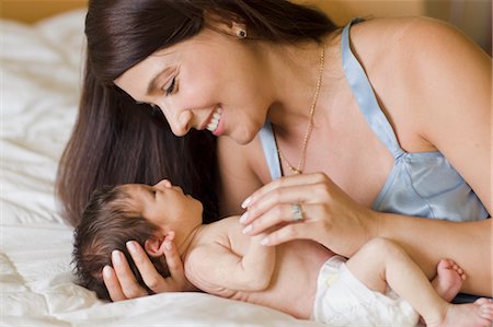 diaper girls picture - Mother Holding Infant Daughter Stock Photo - Rights-Managed, Code: 700-03568029