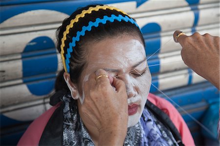 Woman Having Facial Hair Threading, Chinatown, Bangkok, Thailand Stock Photo - Rights-Managed, Code: 700-03586822