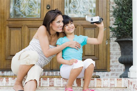 Mother and Daughter Using Video Camera Stock Photo - Rights-Managed, Code: 700-03596280