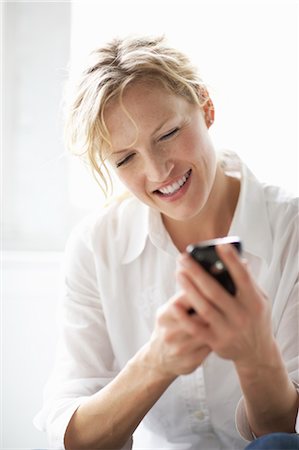 Woman Using iPhone Stock Photo - Rights-Managed, Code: 700-03601476
