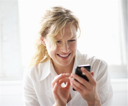 Woman Using iPhone Stock Photo - Rights-Managed, Code: 700-03601477