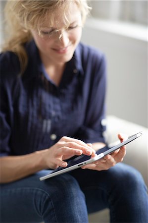 fingers holding - Woman Using iPad Stock Photo - Rights-Managed, Code: 700-03601472