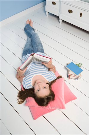 simsearch:700-03615826,k - Girl Lying on Floor and Reading Book Stock Photo - Rights-Managed, Code: 700-03615827