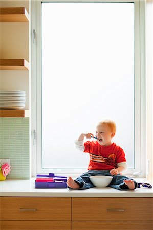 Boy Eating Lunch on Kitchen Counter Stock Photo - Rights-Managed, Code: 700-03613005