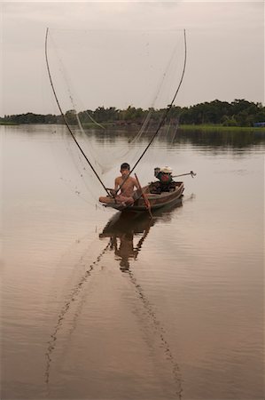 Teenage Boy Fishing on Tha Chin River, Nakhon Chai Si, Nakhon Pathom Province, Thailand Stock Photo - Rights-Managed, Code: 700-03622919