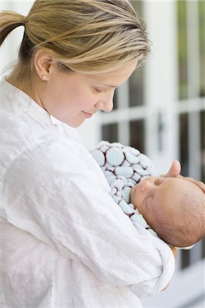 Woman Holding Baby Foto de stock - Con derechos protegidos, Código: 700-03644522