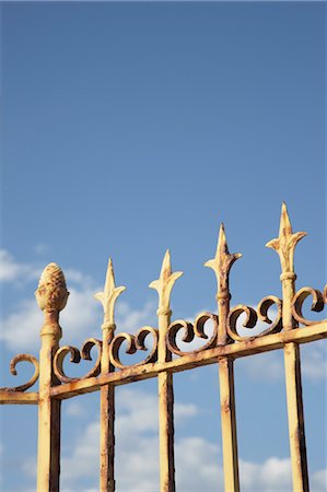 decorative iron - Rusty Fence Against Blue Sky Stock Photo - Rights-Managed, Code: 700-03644909