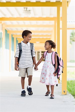 ethnic family holding hands - Brother and Sister Walking Together at School Stock Photo - Rights-Managed, Code: 700-03659119