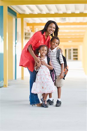 female teacher with young students - Mother with Children at School Stock Photo - Rights-Managed, Code: 700-03659122