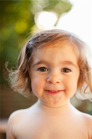 Portrait of Little Girl Smiling Foto de stock - Con derechos protegidos, Código: 700-03696886