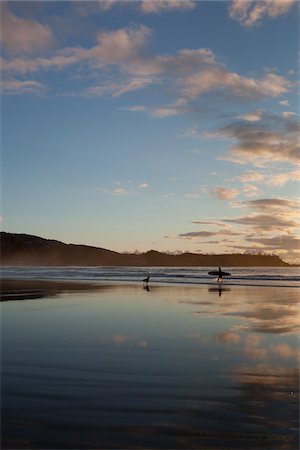 Surfer and Dog on Beach, Chesterman Beach, Tofino, Vancouver Island, British Columbia, Canada Stock Photo - Rights-Managed, Code: 700-03696893