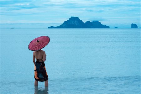 Woman with Umbrella on Nopparathara Beach, Krabi, Thailand Stock Photo - Rights-Managed, Code: 700-03719288