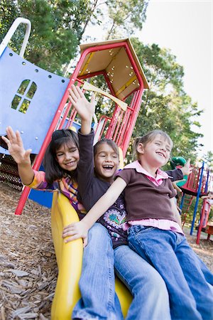 friends silly - Sisters on Playground Slide Stock Photo - Rights-Managed, Code: 700-03719303