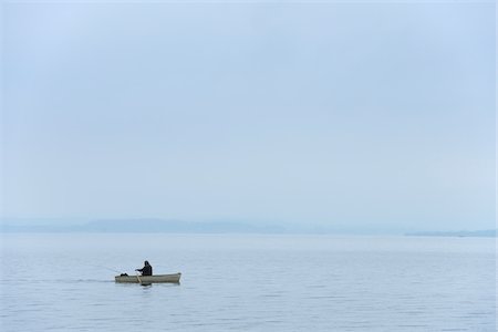 rowing (non sport) - Fisherman in Boat on Lake Chiemsee, Bavaria, Germany Stock Photo - Rights-Managed, Code: 700-03738996