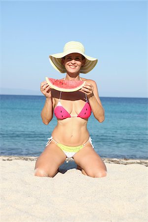 Woman with Watermelon on Beach Stock Photo - Rights-Managed, Code: 700-03739329