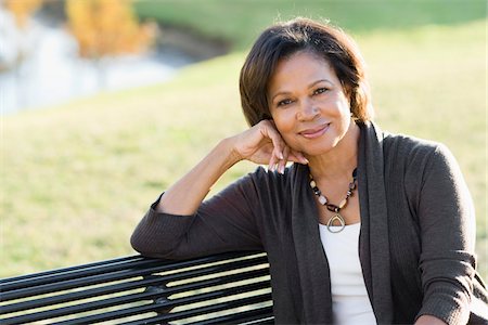 Portrait of Woman Sitting on Bench Stock Photo - Rights-Managed, Code: 700-03762633