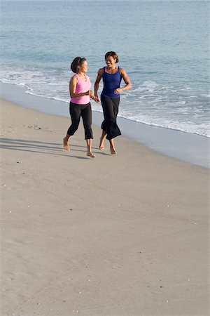 ethnic family exercise - Two Women Jogging on Beach Stock Photo - Rights-Managed, Code: 700-03762645