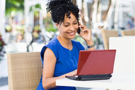 simsearch:700-05451015,k - Woman Using Laptop and Cell Phone at Cafe Stock Photo - Rights-Managed, Code: 700-03762692