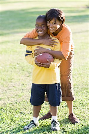family football - Mother Hugging Son Stock Photo - Rights-Managed, Code: 700-03762722