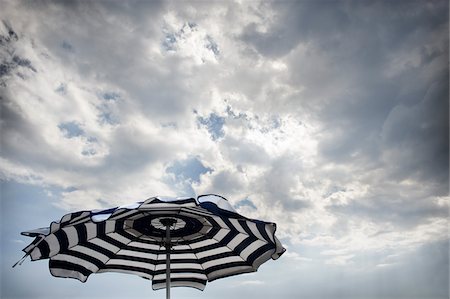 Beach Umbrella and Cloudy Sky Stock Photo - Rights-Managed, Code: 700-03762780