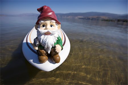 simsearch:700-03739482,k - Garden Gnome on Surfboard in Lake Stock Photo - Rights-Managed, Code: 700-03777182