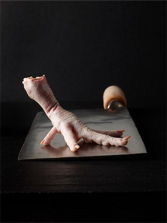 Raw Chicken Foot on Meat Cleaver Stock Photo - Rights-Managed, Code: 700-03805238