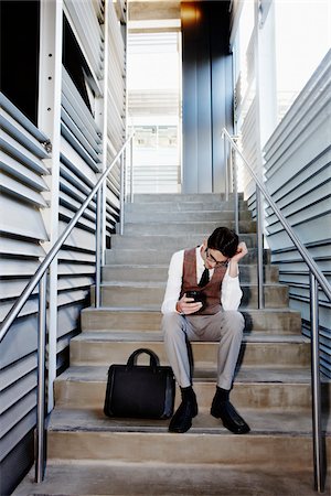 peter griffith - Frustrated Businessman Sitting on Stairs Stock Photo - Rights-Managed, Code: 700-03814375