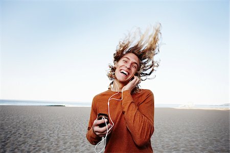 flipped - Young Man Listening to Music on Beach Stock Photo - Rights-Managed, Code: 700-03814402