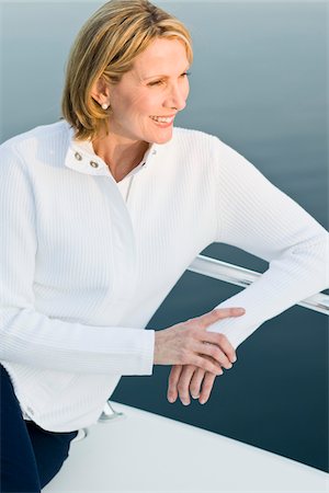 Woman on Boat Watching Sunrise Stock Photo - Rights-Managed, Code: 700-03814686