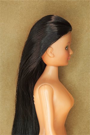 Side View of Doll with Dark Hair Stock Photo - Rights-Managed, Code: 700-03815218