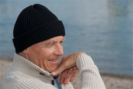 Close-Up of Man Wearing Cap at Beach Stock Photo - Rights-Managed, Code: 700-03848795