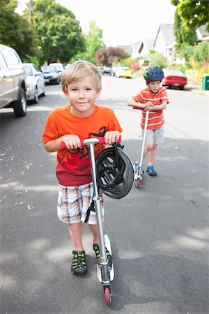 Two Boys Riding Scooters Stock Photo - Rights-Managed, Code: 700-03865246