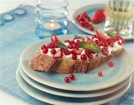 Whipped cream ,summer fruit and mint on a slice of bread Stock Photo - Rights-Managed, Code: 825-05815455