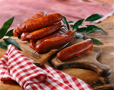 smoked - Sausages on a chopping board Stock Photo - Rights-Managed, Code: 825-05815677