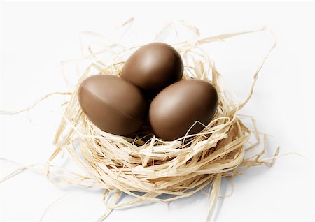 simsearch:825-06047612,k - Three milk chocolate eggs in a nest Stock Photo - Rights-Managed, Code: 825-05815817