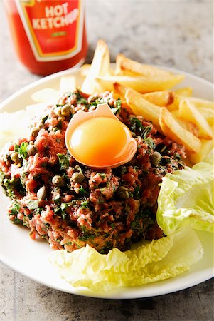 simsearch:825-07649320,k - Steak Tartare with coriander, basil, pepper and citronnella Stock Photo - Rights-Managed, Code: 825-05812965