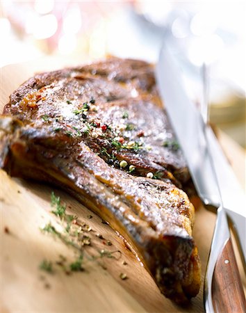 ribs - Rib of beef on chopping board Stock Photo - Rights-Managed, Code: 825-05985428