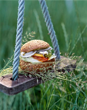 swing (apparatus) - hamburger on swing Stock Photo - Rights-Managed, Code: 825-05986566