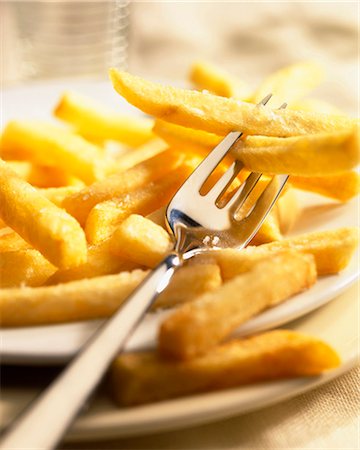 serving gourmet food - Fries on plate with fork Stock Photo - Rights-Managed, Code: 825-05988544
