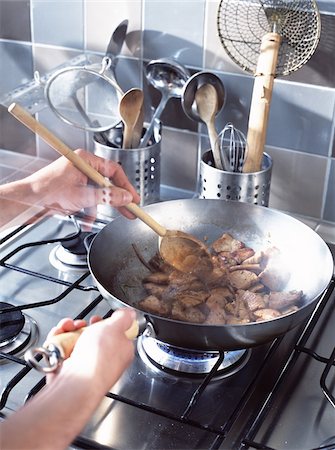 Stir frying pork in pan Stock Photo - Rights-Managed, Code: 825-05988586