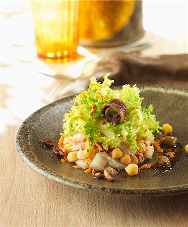 simsearch:825-07649320,k - Revisited Xato salad with salt-cod,anchovies,endive and chickpeas Stock Photo - Rights-Managed, Code: 825-06815256