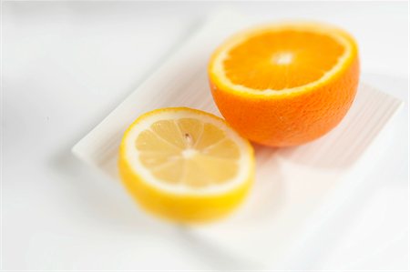 simsearch:825-05812193,k - Half an orange and a slice of lemon Stock Photo - Rights-Managed, Code: 825-06815618