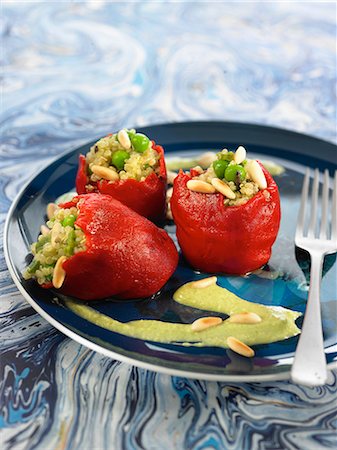 Del piquillo peppers stuffed with quinoa,peas and pine nuts,parsley cream sauce Stock Photo - Rights-Managed, Code: 825-06815775