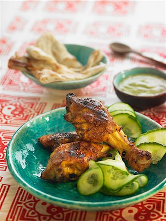 simsearch:825-02302497,k - Tandoori chicken with sliced cucumber Stock Photo - Rights-Managed, Code: 825-06815853