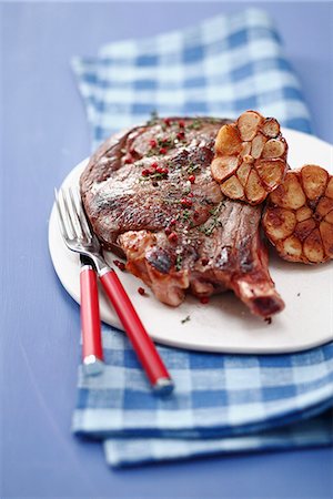 simsearch:825-05985428,k - Grilled beef chop with pink peppercorns,thyme and confit garlic Stock Photo - Rights-Managed, Code: 825-06817497