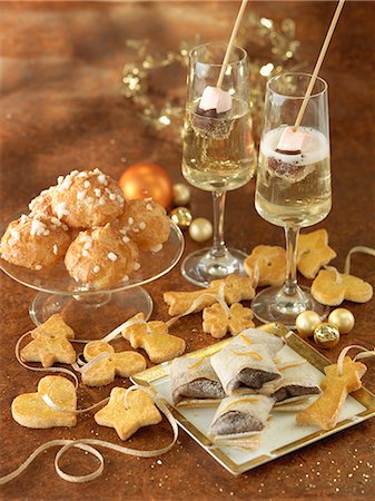 simsearch:825-05985931,k - Almond-flavored choux buns,ribbon of shortbread cookies, Chocolate-orange Pannequets and Champagne with marshmallows and chocolate Stock Photo - Rights-Managed, Code: 825-07076692