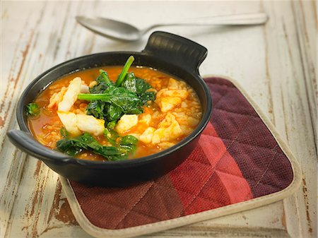 simsearch:825-07522119,k - Rice with salt-cod and spinach in tomato sauce Stock Photo - Rights-Managed, Code: 825-07522298