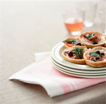 stacked dishes - Individual basil pizzas Stock Photo - Rights-Managed, Code: 825-03627477