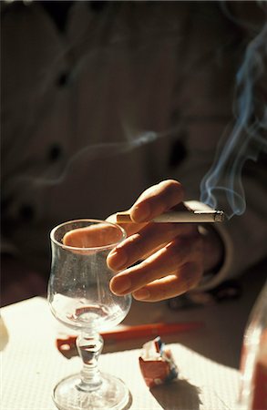 drugs (recreational) - Person smoking and placing an empty glass on the table Stock Photo - Rights-Managed, Code: 825-03627576