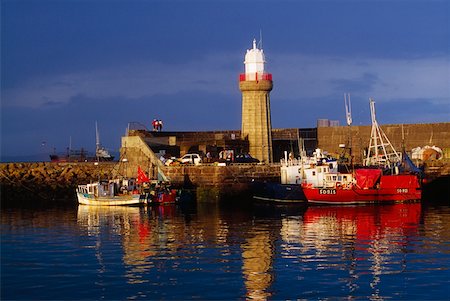 Dunmore East Harbour, County Waterford, Ireland; Fishing trawlers and lighthouse Stock Photo - Rights-Managed, Code: 832-02255434